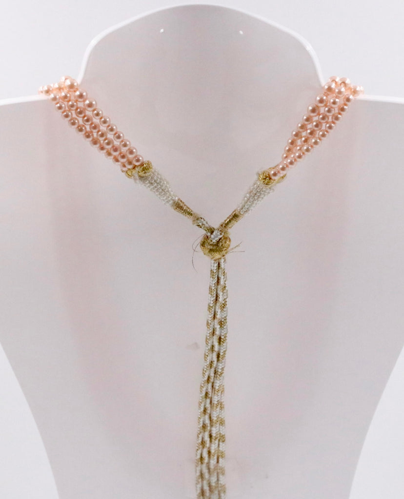 Layered beaded necklace featuring round Swarovski pearl beads