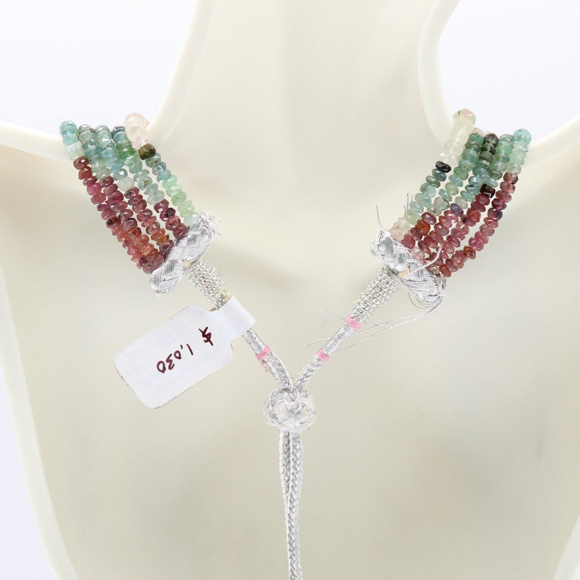 Tourmaline Multi Color Faceted Necklace showcasing vibrant tourmaline beads on a display bust.