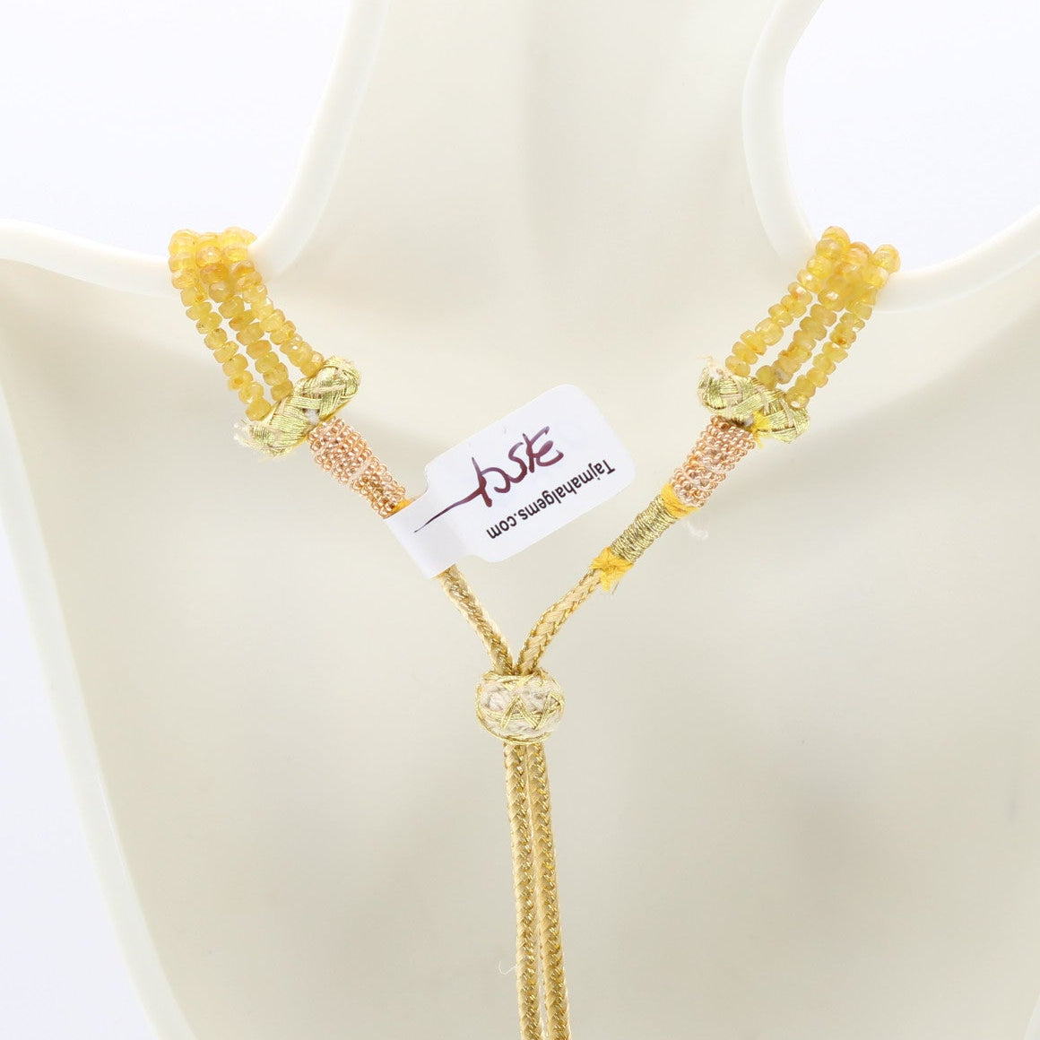 Yellow Sapphire Faceted Necklace showcasing natural yellow sapphires on a display mannequin.