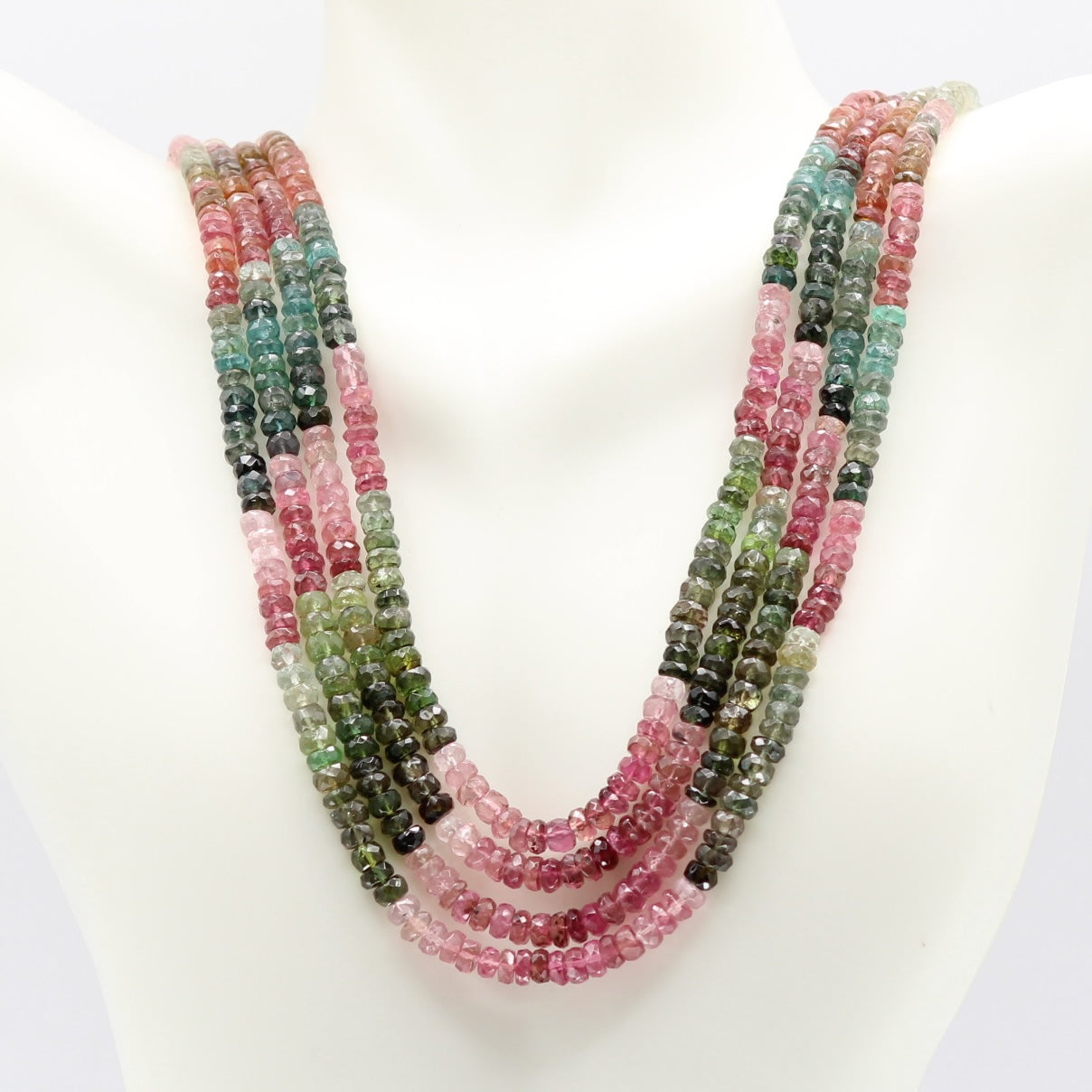 Tourmaline multi color faceted necklace showcasing vibrant hues on a mannequin.