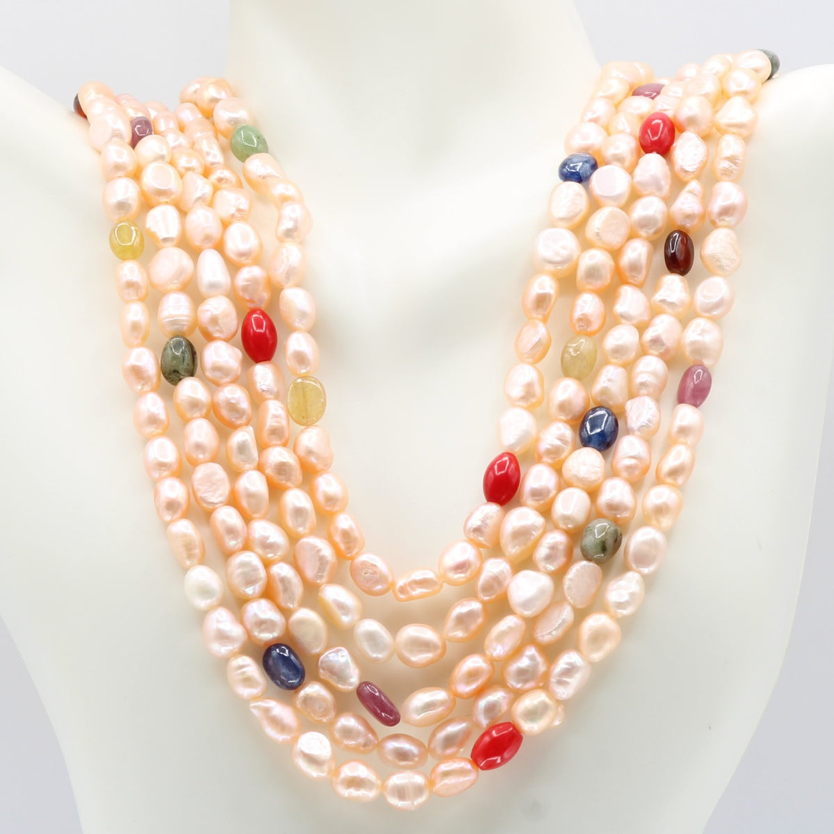 Pearl with Navratna Layered Necklace featuring fresh water pearls and colorful gemstones.