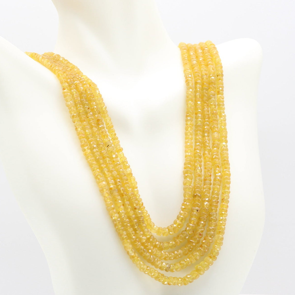 Natural Yellow Sapphire Faceted Necklace showcasing vibrant yellow gemstones on display.