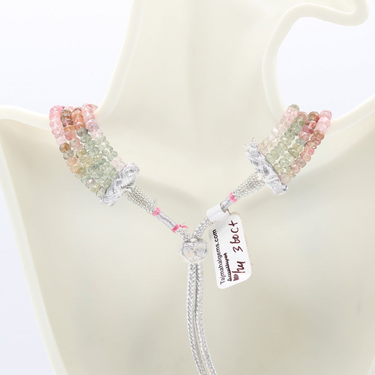 Tourmaline multi color faceted necklace with various shades of gem beads, showcasing elegance and charm.
