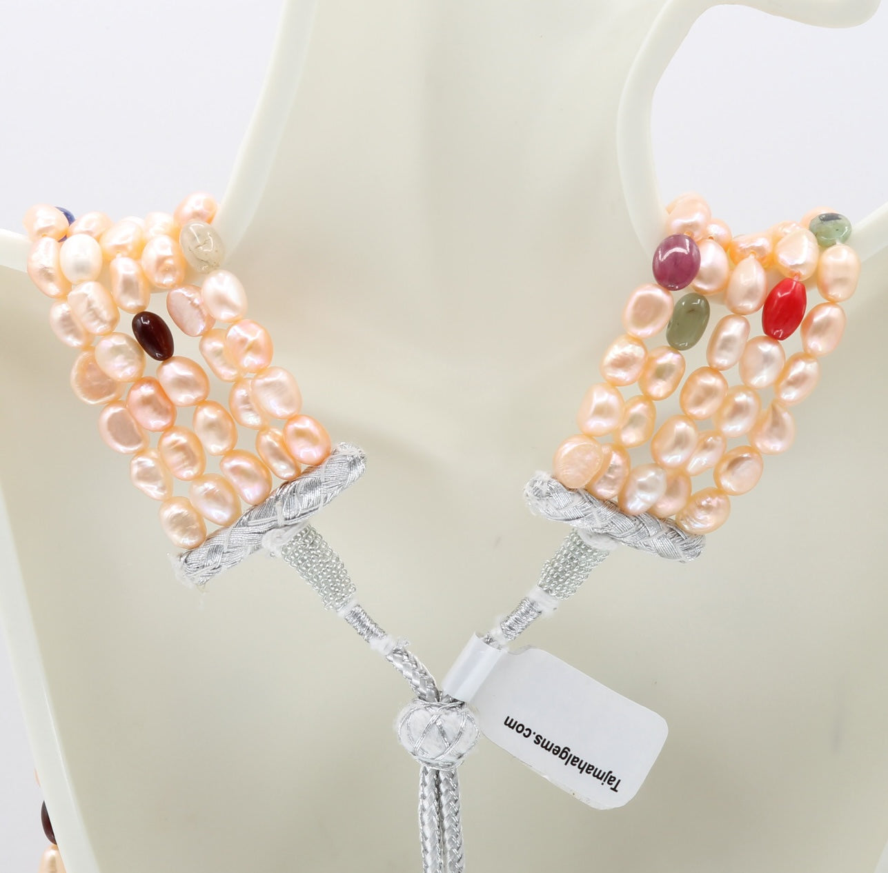 Pearl with Navratna layered necklace showcasing fresh water pearls and colorful gemstones.