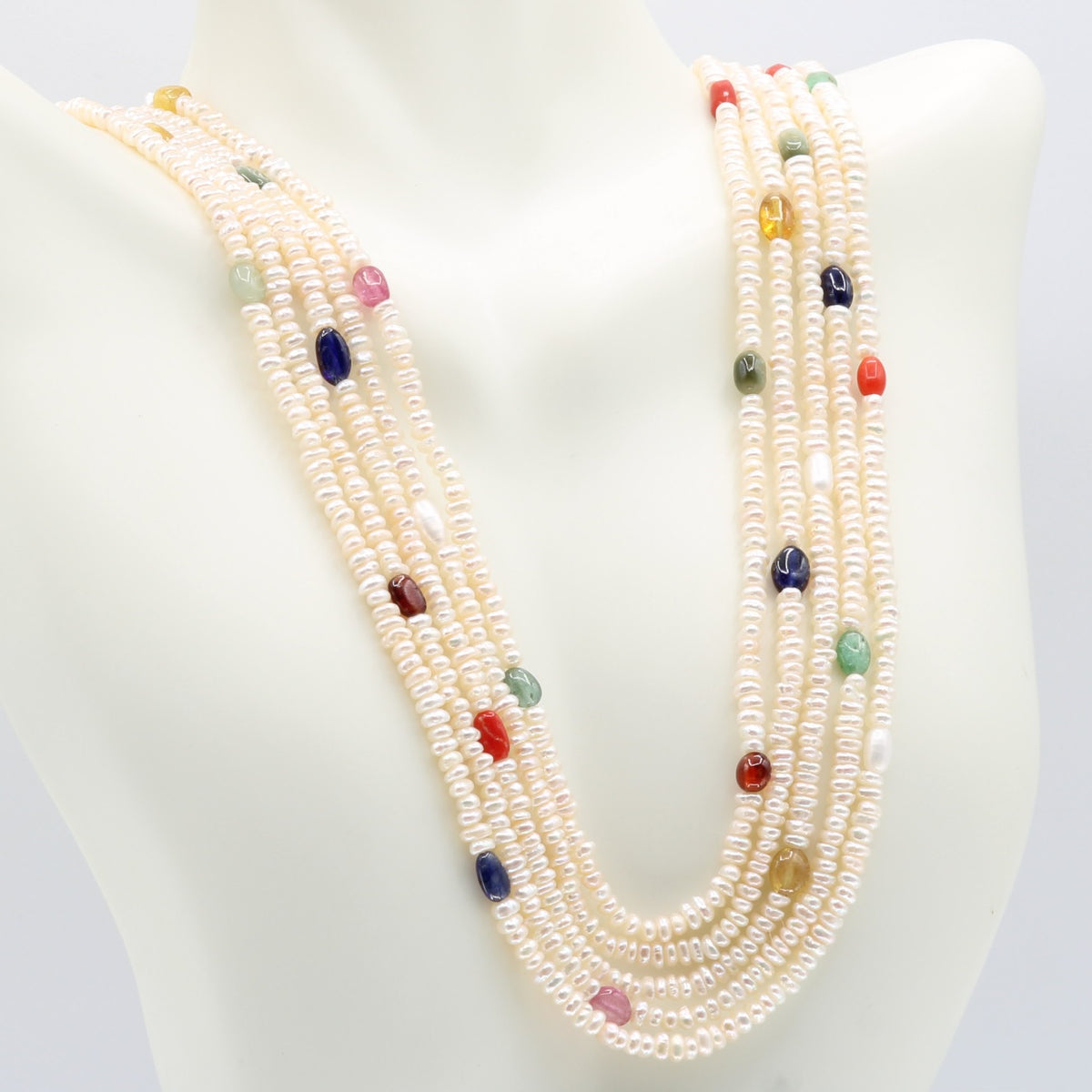 Fresh Water Pearl necklace with Navratna gemstones, showcasing layers of cultured pearls and vibrant colors.