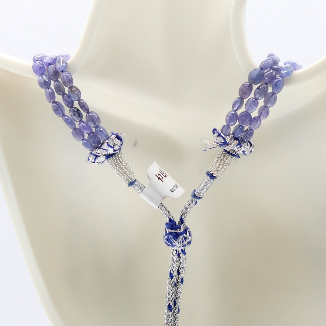 Tanzanite jewelry necklace featuring natural Tanzanite beads on a stylish display, promoting wellbeing and intuition.