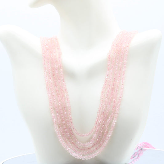 Morganite faceted necklace showcased on a mannequin, featuring delicate pink beads.