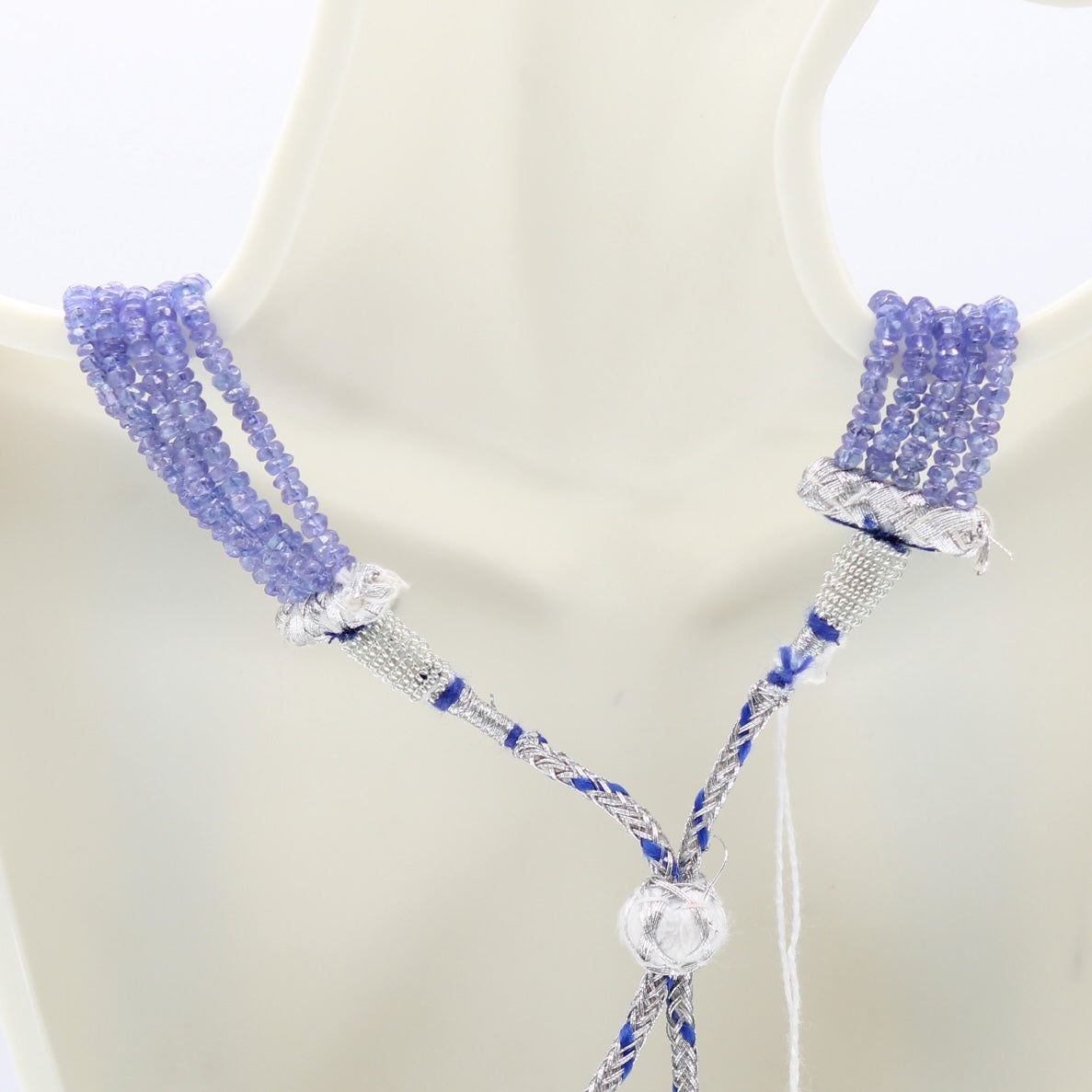 Natural Tanzanite Beaded Necklace with shimmering blue-violet gemstones and metallic embellishments.