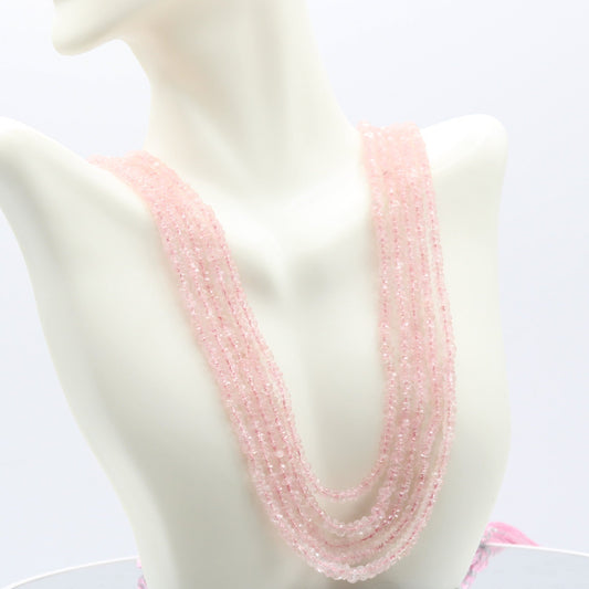 Morganite faceted necklace displayed on a mannequin, showcasing its beautiful pink hue and intricate design.