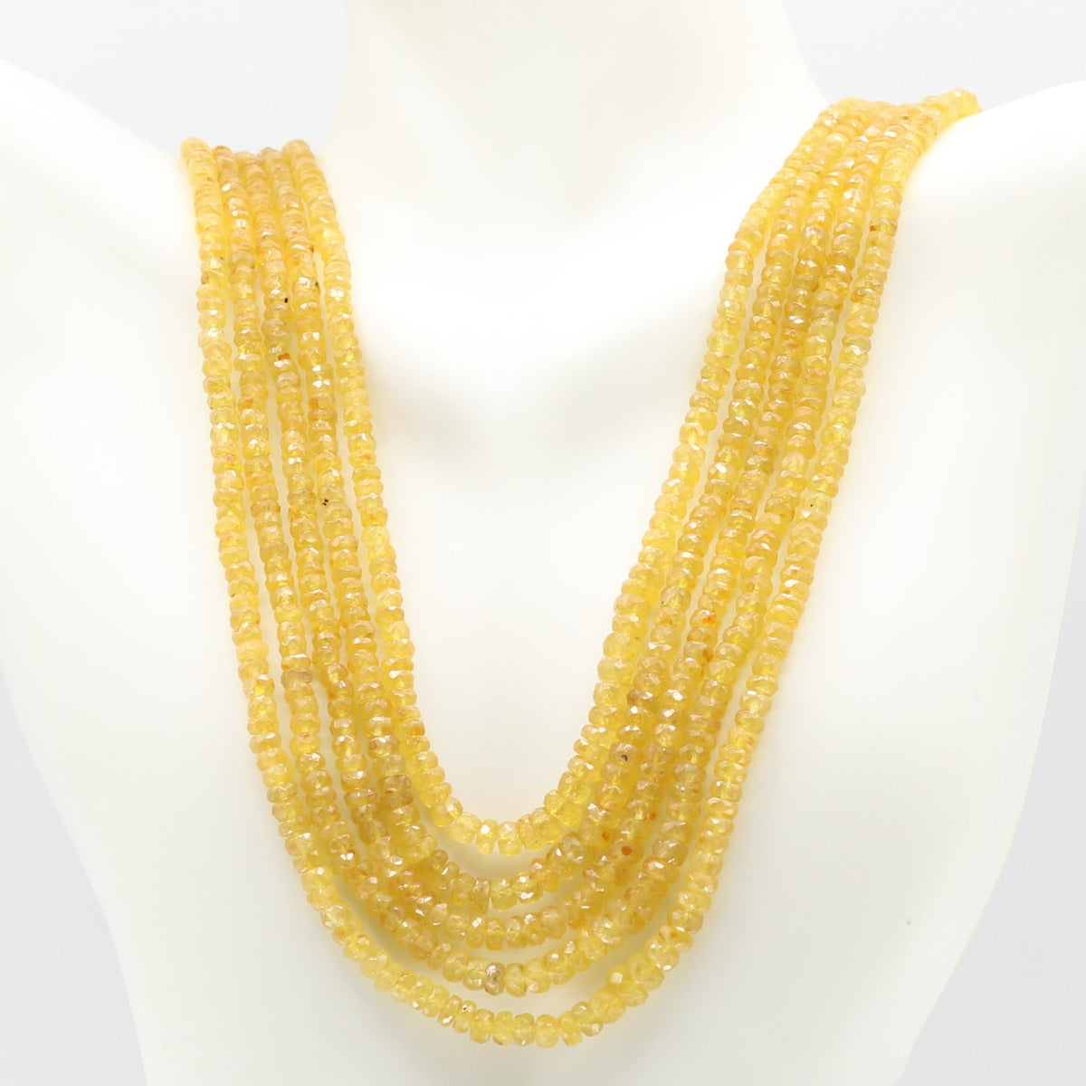 Yellow Sapphire Faceted Necklace showcasing multiple strands of natural yellow sapphires for elegance and spirituality.