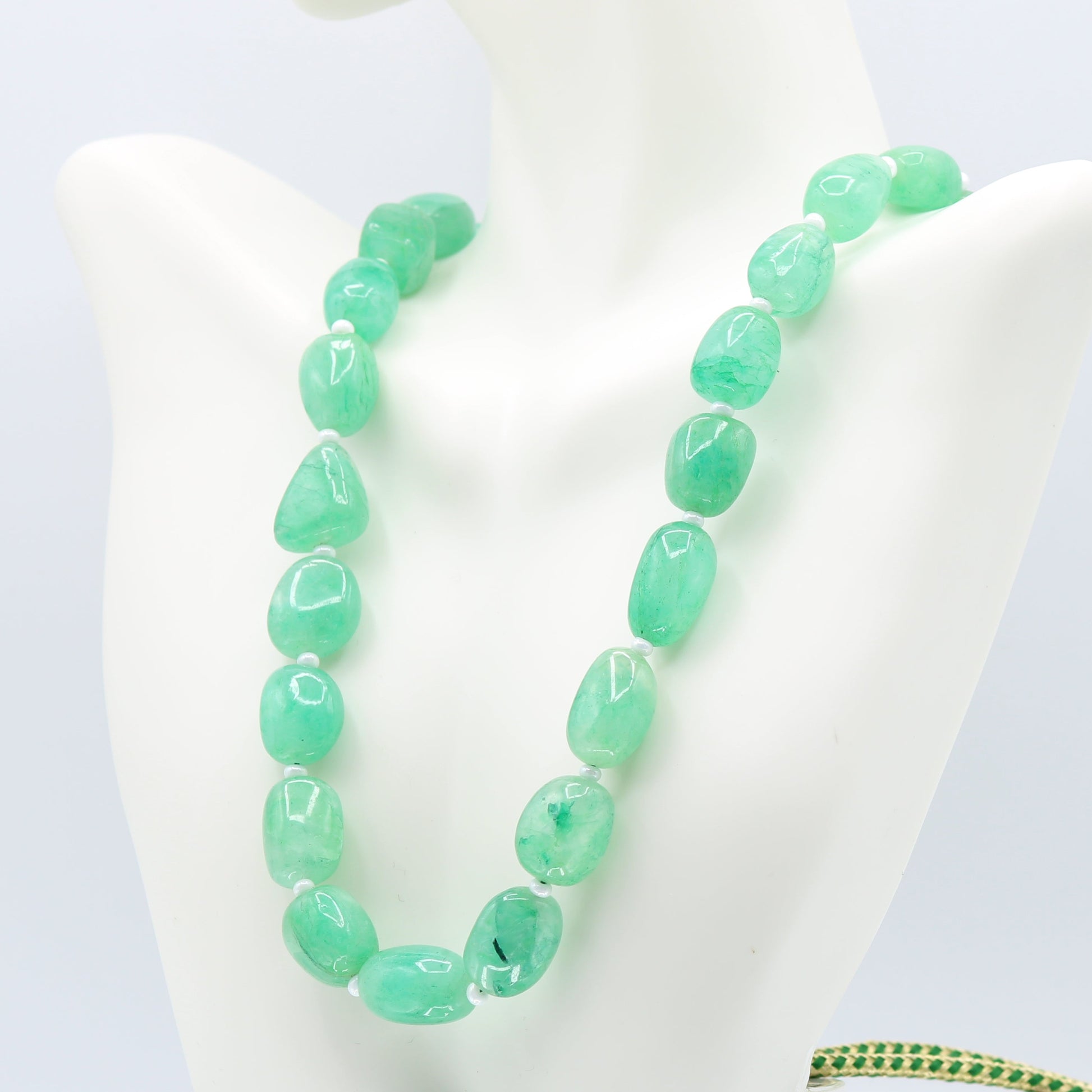Emerald necklace featuring natural Emerald beryl nuggets in bluish green hues, showcasing its semitransparent beauty.