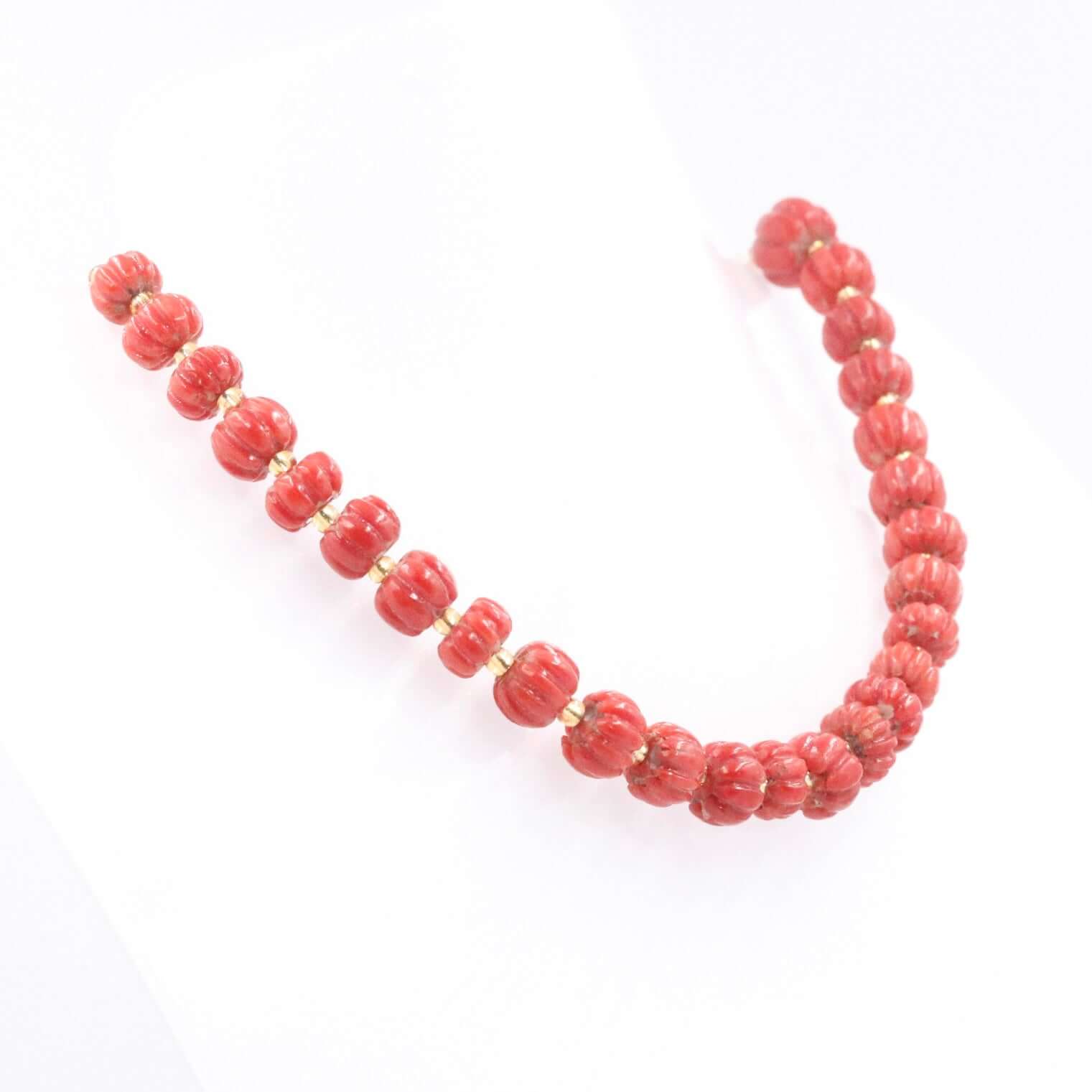 Natural Italian coral beads necklace with red coral pumpkin strands, showcasing vibrant color and unique design.