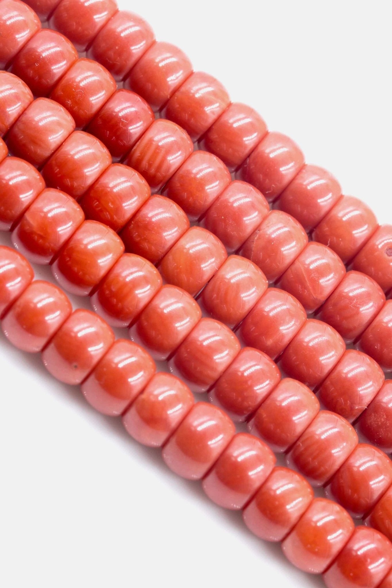 Coral Beads - Natural Antique Italian Red Coral Strand showcasing smooth, shiny red coral beads arranged in a strand.