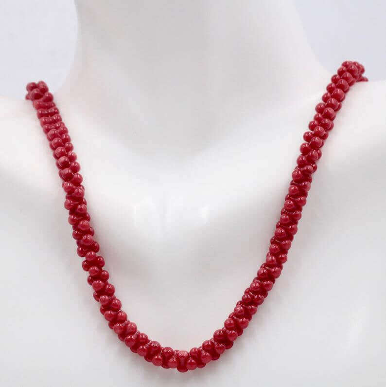 Natural Coral Bead Necklace featuring vibrant red coral, believed to bring good luck and strengthen health.