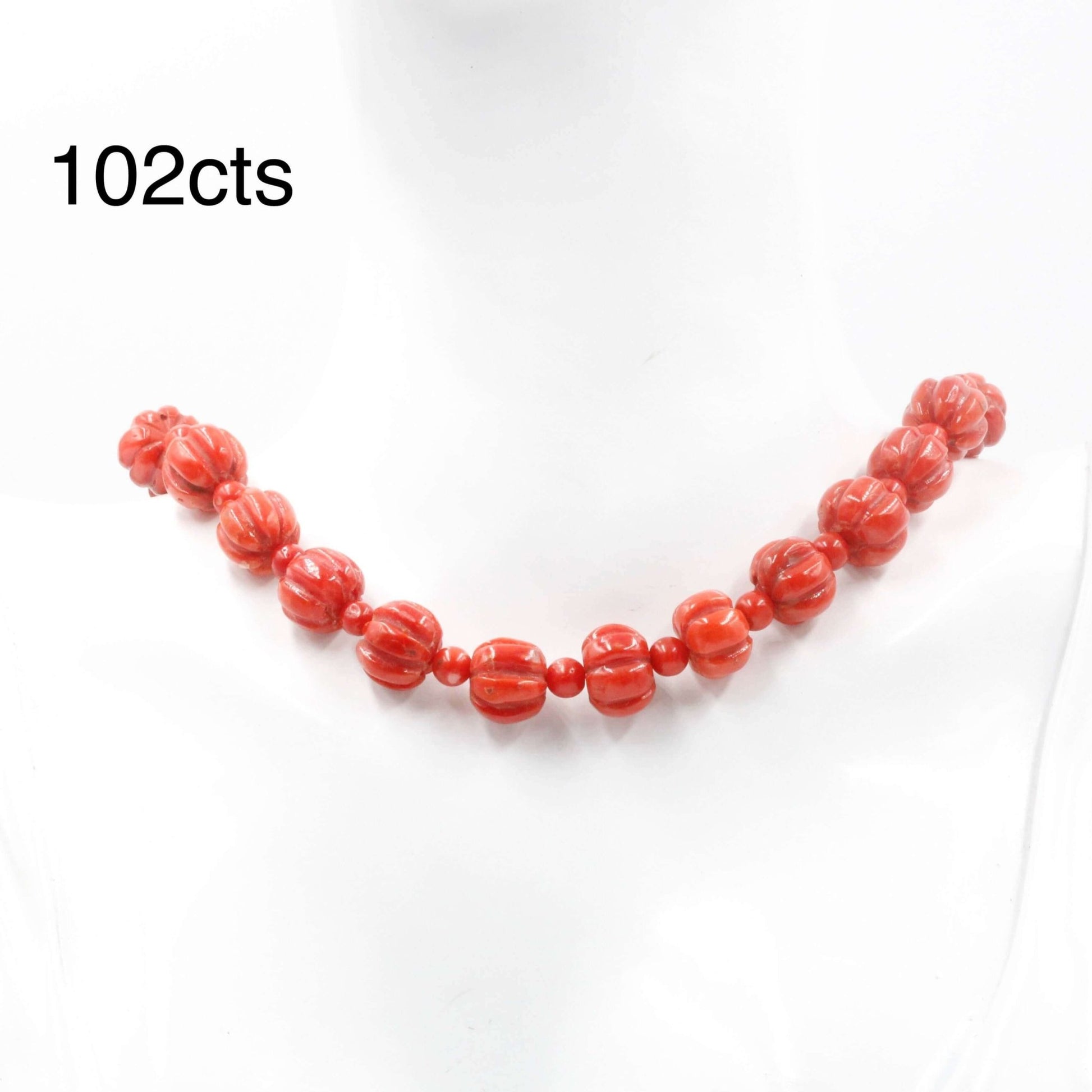 Coral Beads strand showcasing Italian natural red coral, 102cts of vibrant color, perfect for jewelry enthusiasts.