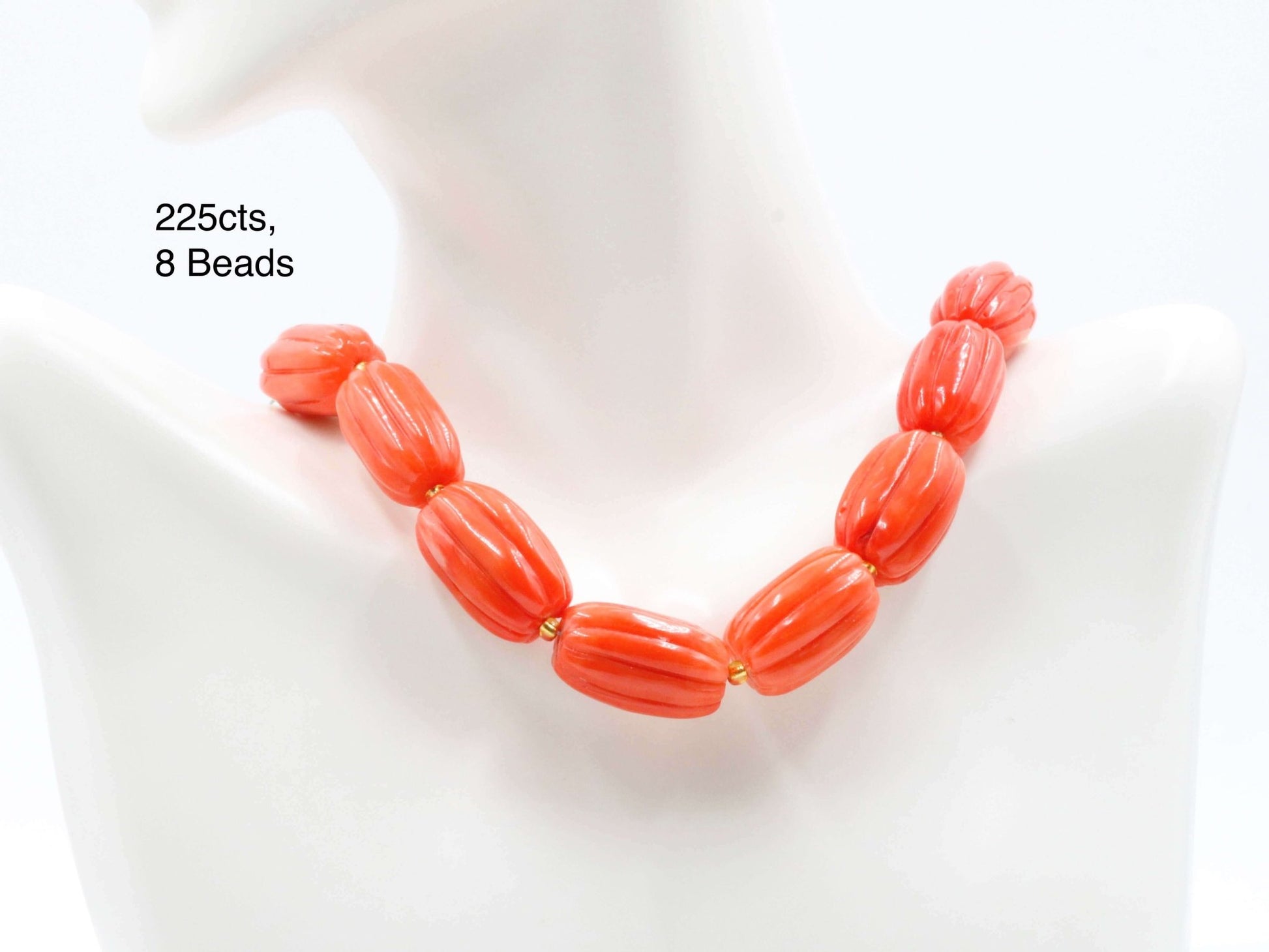 Natural orange coral beads strand featuring 8 unique pumpkin-shaped beads, totaling 225cts.