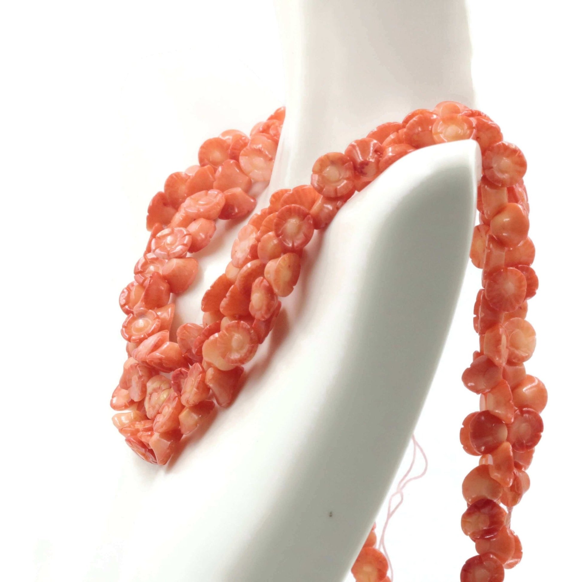 Stunning Orange Coral Flower Beads strand showcasing intricately designed coral flowers.